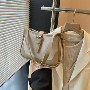 Retro canvas and leather shoulder bag with buckle strap in creamy white and khaki finish