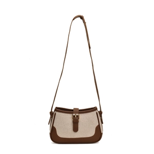 Vintage style beige canvas and brown leather shoulder bag with gold metal buckle