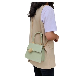 Light green PU leather handbag with gold chain strap and stylish knotted handle design