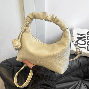 Creamy white lychee texture dumpling bag with pleated handle and knot charm details
