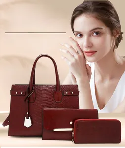 Three-piece set of wine red faux crocodile leather tote bag, wallet and clutch
