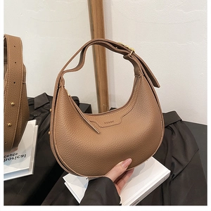Detailed view of brown litchi grain leather hobo bag with adjustable strap and metal zipper