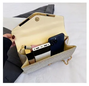 Interior view of the sparkling envelope clutch showing storage for phone and lipstick