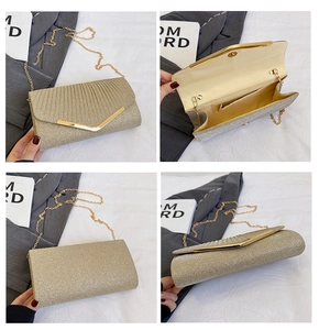 Detail view of champagne glitter clutch showing gold V-trim, texture and inner pocket