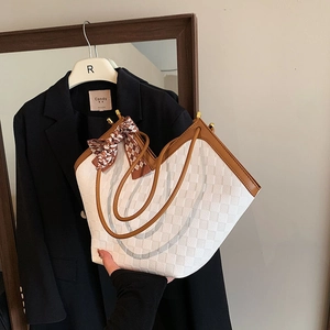 Large capacity tote bag with white textured pattern and brown leather trim and scarf
