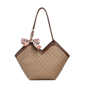 Brown checkered large tote bag with a decorative silk scarf and thin shoulder strap