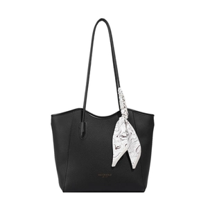 Large black pebbled leather tote bag with elegant silk scarf on white background