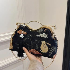 Black embroidered shell bag with gold chain and rabbit pattern in modern Chinese style
