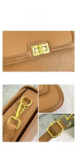 Détails de sac en cuir marron avec fermoir rotatif doré et coutures de précision