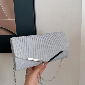 Sparkly silver envelope evening clutch bag with V-shaped metal trim and chain strap