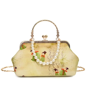 Retro shoulder bag with Chinese embroidery, pearl handle, and metallic chain strap