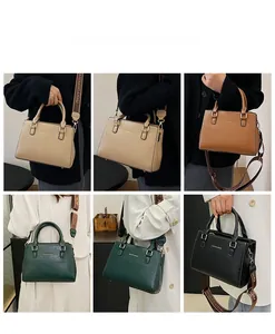 Detail of stylish boston bag with textured PU leather and detachable jacquard shoulder strap