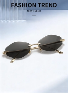 Detail of luxury rimless sunglasses with smokey geometric lenses and gold metal frames