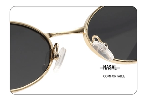 Detail of adjustable silicone nose pads on gold metal frame sunglasses for comfort