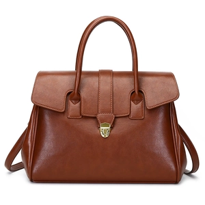 Classic brown vintage leather tote bag with gold hardware and top handles for women