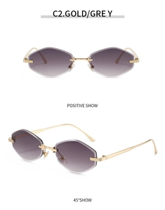 Detail view of gold metal rimless sunglasses with hexagonal diamond cut grey lenses