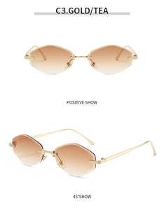 Detail view of gold metal hinges and gradient tea lenses on rimless sunglasses