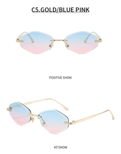 Close-up of rimless gradient blue-pink sunglasses with gold metal frame and diamond cut lenses