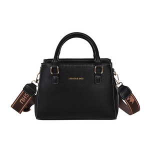 Minimalist black PU leather tote bag with gold lettering and striped crossbody strap