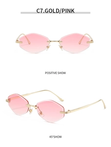 Detail view of gold rimless geometric sunglasses with pink gradient cut-edge lenses