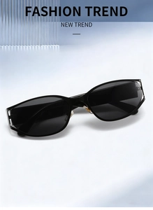 Detail of black oval frame sunglasses with silver metallic temple accents and dark lenses