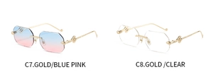 Detail of rimless sunglasses with gold snake shaped metal temples and gradient lenses