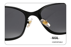 Detail shot of comfortable nasal pads with gold metal inserts on black oval sunglasses