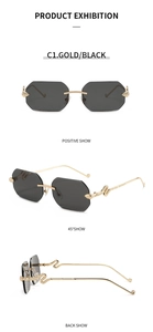 Detail view of gold snake-shaped temple design on rimless octagonal sunglasses
