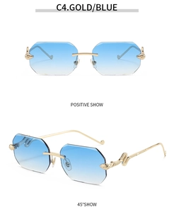 Detail view of gold rimless octagonal sunglasses with snake pattern temple and blue lenses