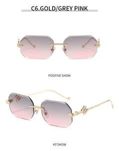 Detail of octagonal rimless sunglasses with gold serpent engraved temples and gradient lenses