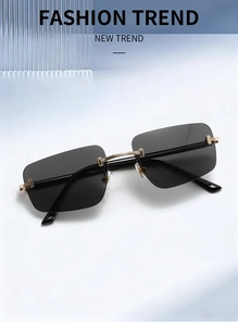 Detail of rimless rectangle sunglasses with black lenses and golden T-shaped metal hardware