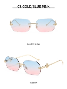 Detail of rimless polygon sunglasses with gold wave temples and blue pink gradient lenses
