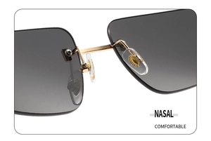 Detail of rimless sunglasses featuring golden metal bridge and soft nasal pads