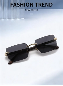 Detail view of square rimless sunglasses with gold metal bridge and dark wood grain temples