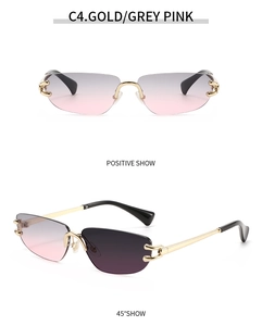 Frameless sunglasses with gold C-shape hardware and grey-pink gradient lenses