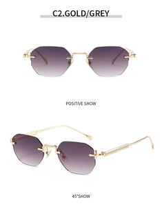 Détail de lunettes de soleil octogonales sans monture avec cadre en métal doré