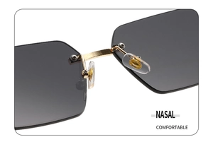 Detail of adjustable silicone nose pads and golden bridge on rimless sunglasses