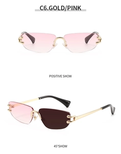 Close-up of rimless gradient pink sunglasses with gold metal temples and nose pads