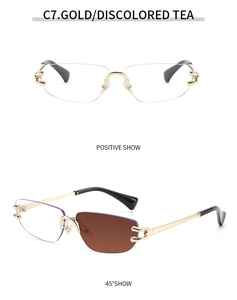 Detail of rimless gold metal sunglasses with color-changing tea lenses and unique hinges