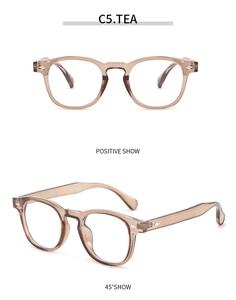 Detail view of tea-colored vintage round frame glasses with silver diamond rivets