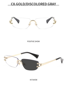 Detail view of gold rimless sunglasses featuring photochromic lenses and hollow temple design