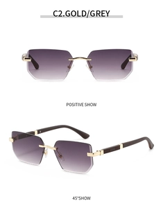 Detail view of gold metal bridge and dark grey gradient geometric lenses on frameless glasses