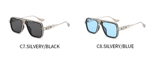 Detail of retro aviator sunglasses with silver metallic frames in black and blue lenses