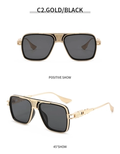 Detail of vintage aviator sunglasses in gold and black with textured metal bridge