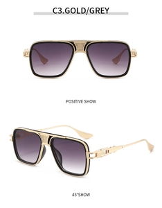 Detail view of gold and black pilot sunglasses with grey gradient lenses and side cut-outs