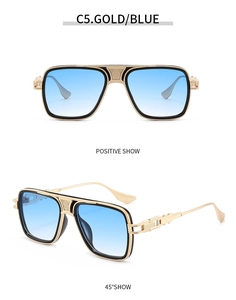 Macro view of aviator sunglasses with gold metal frame and blue gradient lenses