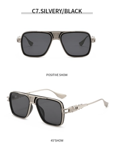 Detail view of silver metal aviator sunglasses with textured bridge and industrial temples