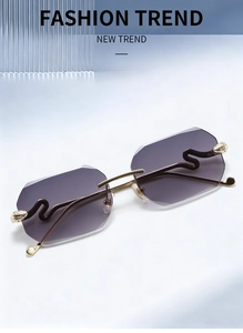 Close-up of rimless gradient purple lenses and golden snake-shaped metal temples on sunglasses