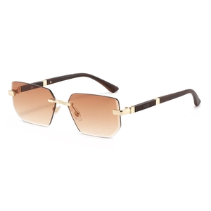 Fashionable rimless geometric sunglasses with brown gradient lenses and gold metal hinges