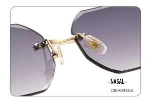 Detail of adjustable nose pads and gold metal bridge on frameless gradient sunglasses